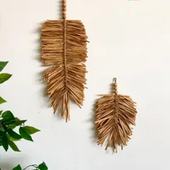 These macramé leaf hangings are made from natural raffia, giving them a wonderfully rustic and earthy texture. They are perfect for adding a touch of nature-inspired art to your walls.