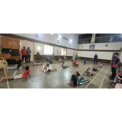 Our students practicing the cobra pose during our International Yoga Day celebration. We believe flexibility and core strength are essential for preventing injuries and improving performance.