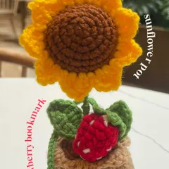 Brighten up any space with this adorable crochet sunflower in a pot. It's a perfect companion for my strawberry bookmark.
