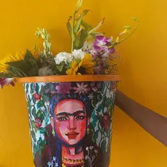 This Frida Kahlo planter is one of my favorite pieces. I used bold colors and intricate details to capture her spirit, turning a simple planter into a vibrant piece of home decor that really makes a statement.