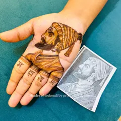 Here you can see my finished henna portrait of Shivaji Maharaj next to the reference sketch. This shows how I translate a detailed drawing into a beautiful mehendi design.