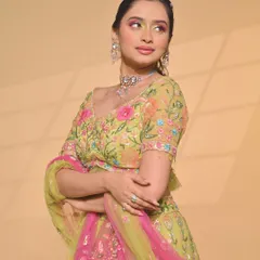 A vibrant and creative look by one of my students, featuring a colourful floral lehenga and bold, artistic eye makeup. This shows their confidence in playing with colour.
