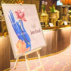We cater to all dietary needs with grace and authenticity. This sign for our dedicated Jain Food counter at a grand event shows our commitment to providing delicious options for every guest.