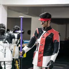 An athlete preparing his equipment at the firing line, a common sight during daily training sessions at my academy.