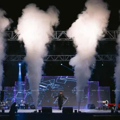 This is where performance meets production. A charismatic artist takes the stage, framed by dramatic fog effects and a custom LED backdrop. We use advanced technical production to amplify every performance, creating an immersive experience for corporate shows and celebrity nights.