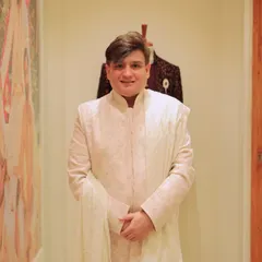 A closer look at a sophisticated off-white sherwani from the Tasva collection. I help grooms find outfits that exude class and comfort for their wedding festivities.