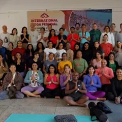 A group photo with students after a session at the International Yoga Festival in Rishikesh.