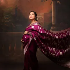 A majestic solo portrait of the mother-to-be, with her saree flowing around her. This shot captures a sense of grace and power.