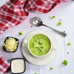 Warm, creamy, and oh-so-cheesy. Our homemade Broccoli Cheese Soup is the ultimate comfort in a bowl, served with extra cheese on the side.