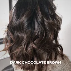 This dark chocolate brown is a classic for a reason. We added subtle dimension with lighter tones and styled it with soft waves for a rich, luxurious finish.