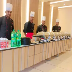 A stylish buffet setup integrated with the venue's modern decor. Our team ensures our presentation enhances the overall look of your event.