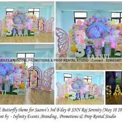 A unicorn and butterfly theme for Saanvi's 3rd birthday. This beautiful setup combines two popular themes with a unicorn backdrop, butterfly wing props, and a pastel balloon garland.