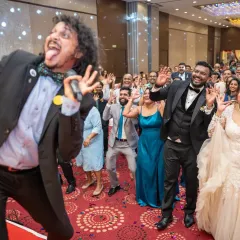 The energy is electric when the emcee, the couple, and the guests are all in sync on the dance floor. I love capturing these high-octane, candid moments that show the pure joy of a wedding party.