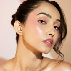 Another angle showcasing the art of face draping. The light catches the high points of the face, revealing a beautiful, healthy sheen on the skin.