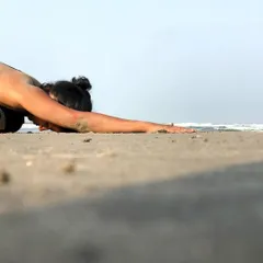 Every new day is an opportunity to create the life you want. A quiet moment in child's pose on the beach, surrendering and setting intentions.