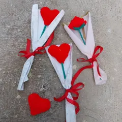A collection of my Valentine's Day orders, featuring heart bouquets, rose bouquets, and heart keychains. Love is in the handmade details!