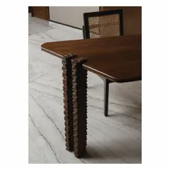 We believe in the poetry of details. These hand-carved legs for a study desk are a testament to the incredible skill of local artisans we collaborate with. Each groove is meticulously crafted, transforming a simple table into a unique piece of functional sculpture.