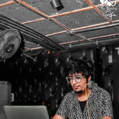 A candid moment of me mixing tracks during a Bollywood night at The Boozy Griffin. My job is to blend the best hits to keep the party going.