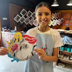 Look at that smile. This is the best part of my job, seeing a young artist proudly show off a piece they created with their own hands. This collagraph project allowed her to play with textures and shapes to make something truly unique.
