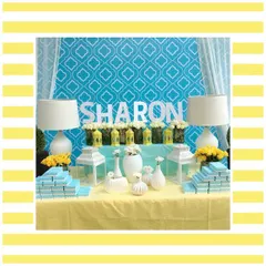 The dessert and favor table for the Tuscan-themed luncheon. The blue and yellow color scheme was carried through in the backdrop and decor details for a cohesive look.