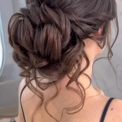 This textured, romantic updo is one of my most requested styles for receptions and cocktail parties. The interwoven sections and soft tendrils create a look that is both sophisticated and effortlessly beautiful.