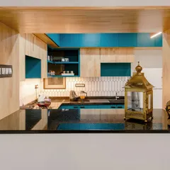 A pass-through window from the T7 T8 kitchen, framed in rubberwood. This design feature connects the kitchen to the living area while providing an extra serving counter.