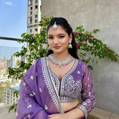 This bridesmaid looks stunning and confident. The makeup is natural yet polished, and the simple hairstyle keeps the focus on her beautiful smile and outfit.