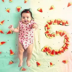 My studio offers plenty of floor space for creative setups like this milestone baby photoshoot. This top-down shot was easily achieved, and the dual-tone backdrop shows how you can combine different colored paper rolls for a unique look.