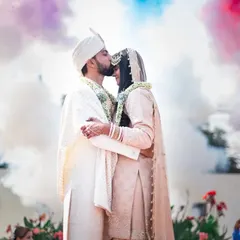 A cinematic finale to the wedding day. Using creative elements like colored smoke adds a touch of magic and creates a truly unforgettable portrait for the couple.