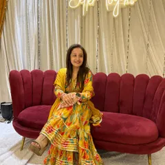 A candid moment sitting at the wedding event. The decor, the lights, the happiness, it's all part of the beautiful experience.