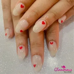 Wear your heart on your nails. This super cute and simple design features a sheer, milky white base with a tiny, perfectly-painted red heart on each nail. It's a minimalist look fatores a lot of love.