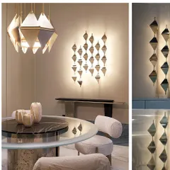 This dining area features a complete set of our custom geometric lighting. The design of the hanging pendant light is mirrored in the illuminated wall sconce, creating a cohesive and sophisticated lighting scheme.