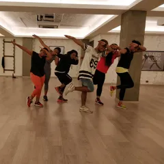 The "dab" pose after a fun and sweaty dance exercise. This picture perfectly captures the playful and modern vibe of our classes. We are all about enjoying the fitness journey.