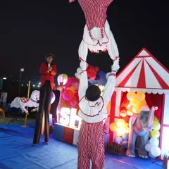 Our professional circus performers bring the magic of the big top to your event. This act features a duo of acrobats performing incredible feats of balance and strength, leaving guests of all ages in awe.