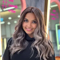 This is my signature balayage transformation, designed to create a beautiful gradient from dark to light. The result is a multi-dimensional look with soft waves that catch the light perfectly, giving the hair movement and shine.
