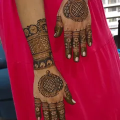 A matching set of hand and foot mehendi, featuring mandala designs for a coordinated look.