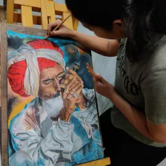 Here I am adding the final touches to my first soft pastel portrait. This piece was a huge learning experience, teaching me how to blend colors to create depth and realism.