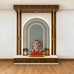 A modern pooja unit with a multi-layered arch design and soft backlighting. The design includes a pedestal for the main idol and hanging brass bells for a traditional touch.