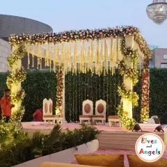 The mandap is the heart of the wedding, and I make sure it is unforgettable. This outdoor mandap features a clean, white structure wrapped in beautiful floral arrangements and hanging jasmine garlands. The soft lighting and elevated platform ensure that all eyes are on the sacred ceremony.