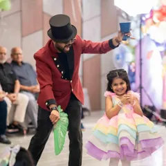 The birthday girl's smile says it all. This performance took place in a spacious party hall, where I had plenty of room for big illusions and lots of audience interaction.