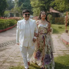 Walking together in style. This candid shot from a pre-wedding event captures the couple's effortless chemistry and chic outfits.