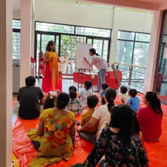 Here you can see both the author and illustrator in action during the "A Bounty of Chilies" book launch. The kids were captivated as the story was read aloud while drawings were created live.