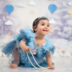 Looking up at a future full of wonder. This candid shot from a first birthday session captures pure innocence.