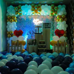 Another perspective of the anniversary decor with blue and green lighting. This shows how I can use lights to change the mood and match the theme of your special evening.