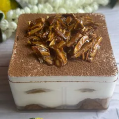 This Coffee Rasgulla Tiramisu Tub is another one of my Diwali specials. It layers coffee-soaked rasgullas with creamy mascarpone and a crunchy almond praline topping.