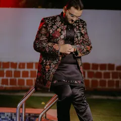 Another angle of my popular black floral embroidered Indo-Western jacket. This shot shows how the outfit looks from the side, highlighting the detailed embroidery on the sleeves and the sleek silhouette of the matching kurta and pants.