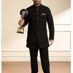 Actor Allu Arjun looking sharp in a classic black Jodhpuri suit I designed. This timeless piece is perfect for award ceremonies and formal gatherings, offering a clean silhouette with a touch of traditional elegance.