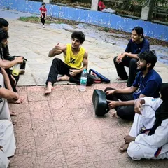Explaining a concept to the group. We foster an environment where students can ask questions and learn from each other.