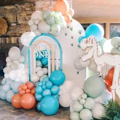 A "Roaring One" dinosaur theme in a unique pastel color palette. I love giving popular themes an artistic twist, combining cute dinosaur skeletons and footprints with soft, modern colors.