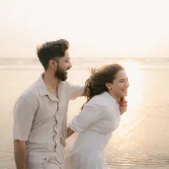 Capturing pure joy as a couple laughs and plays in the surf during their golden hour beach shoot. These are the unposed, happy memories I love to freeze in time.